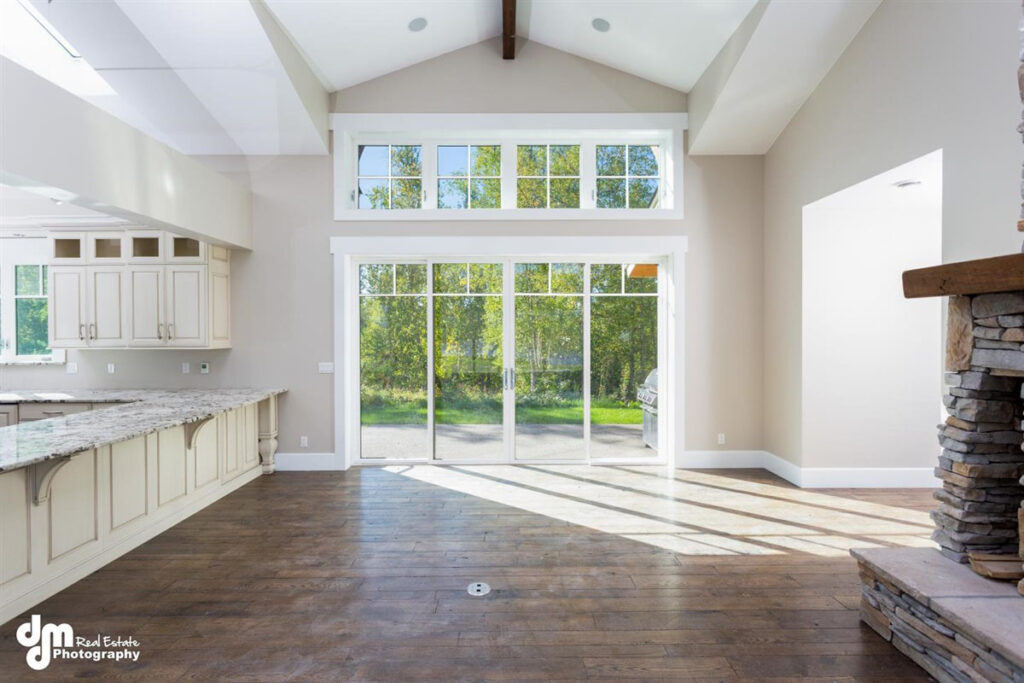 Open concept living room with patio doors and fireplace